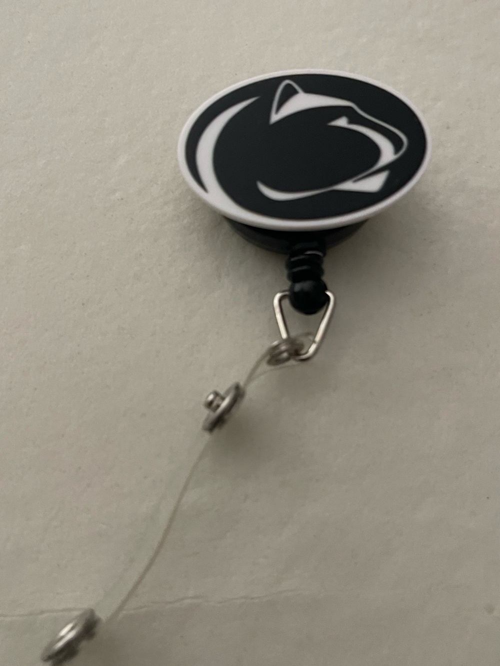 Black Retractable Badge Reel with White Logo - badge Accessory
